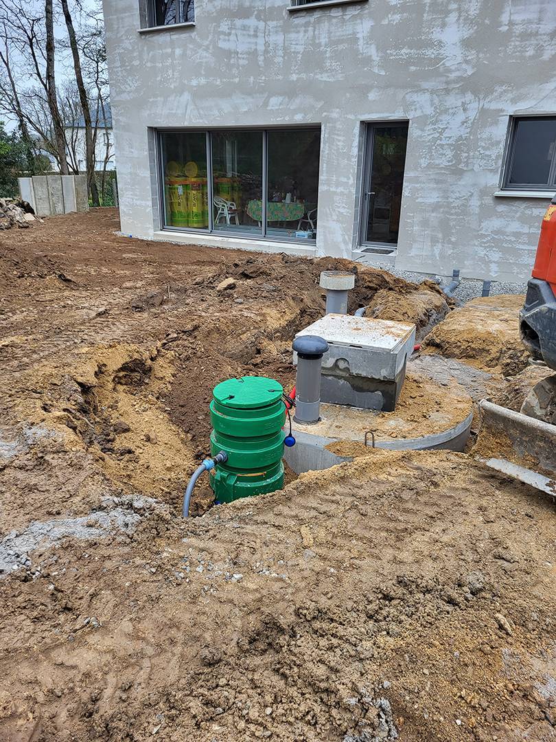 assainissement terrain devant maison construction